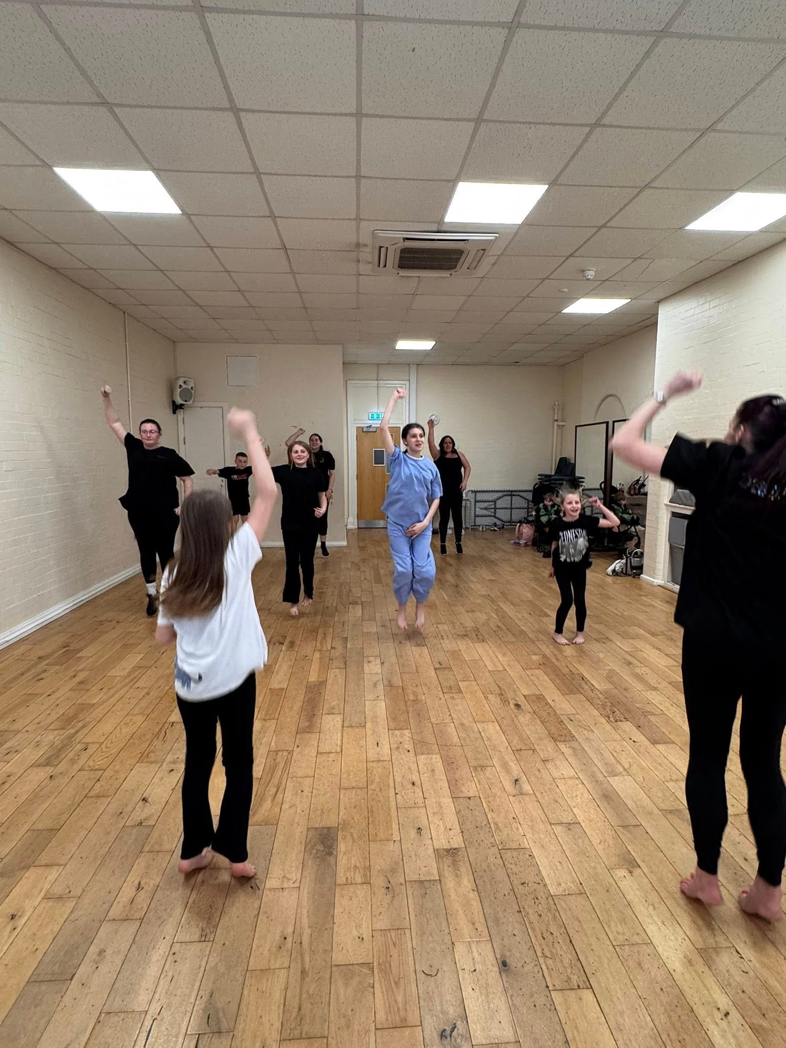 Students practising choreography in the dance studio